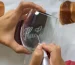 Close-up of laser glass engraving process creating custom designs.